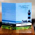 Memorial card with lighthouse on the front