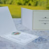 Folding acknowledgement card with cream background and floral pattern on the front