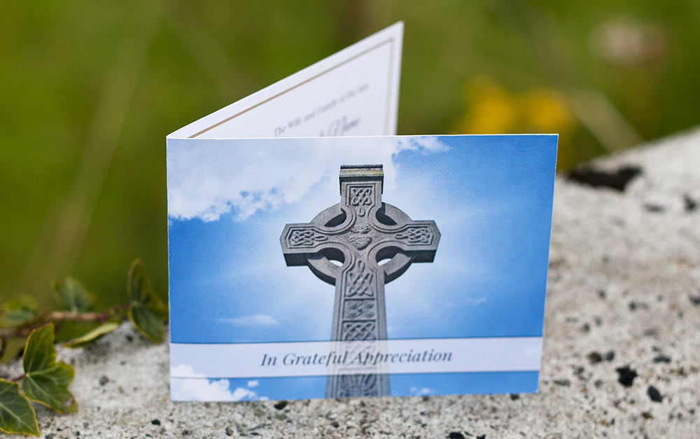 Folding funeral thank you card with stone Celtic cross on the front.