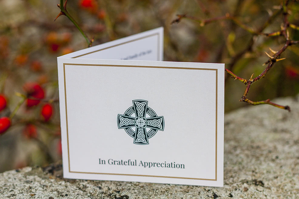 Folding acknowledgement card with Celtic cross on the front