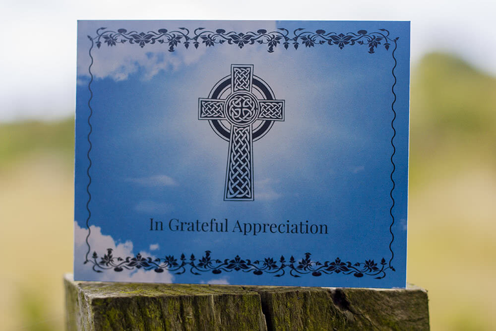 Funeral thank you card with black cross on the front