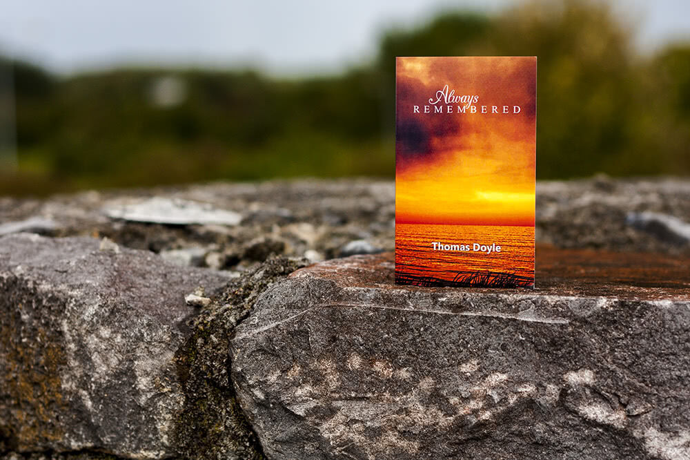 Scenic folding memorial card with sunset motive