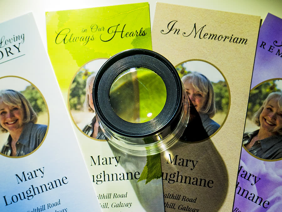 Closeup of bookmarks with an eyeglass in the center, illustrating print quality control.